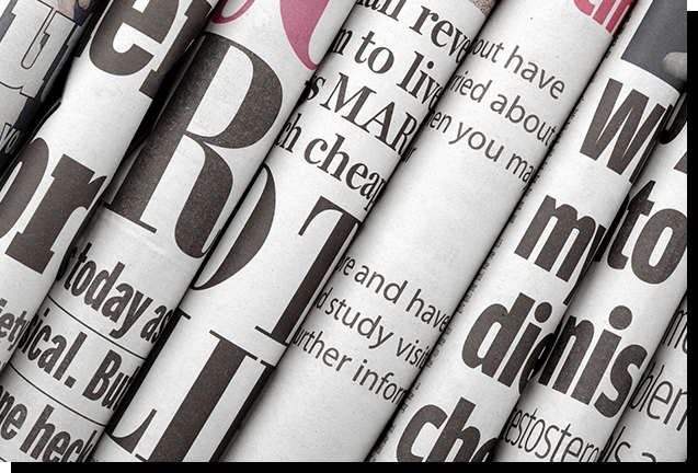 A close up of several newspapers with the words " npr ".